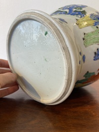 A Chinese famille rose 'playing boys' vase on a fine carved wooden stand, Yongzheng