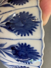 Two Chinese blue and white bowls, a small plate and a caf&eacute;-au-lait ground sprinkler, Kangxi