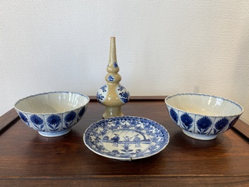 Two Chinese blue and white bowls, a small plate and a caf&eacute;-au-lait ground sprinkler, Kangxi