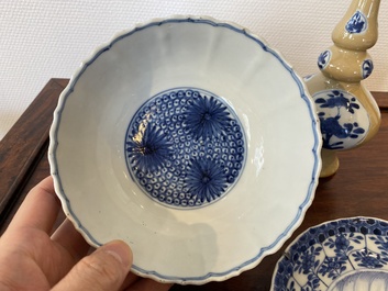 Two Chinese blue and white bowls, a small plate and a caf&eacute;-au-lait ground sprinkler, Kangxi