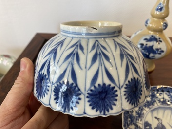 Two Chinese blue and white bowls, a small plate and a caf&eacute;-au-lait ground sprinkler, Kangxi