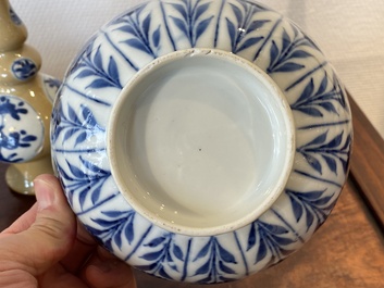 Two Chinese blue and white bowls, a small plate and a caf&eacute;-au-lait ground sprinkler, Kangxi