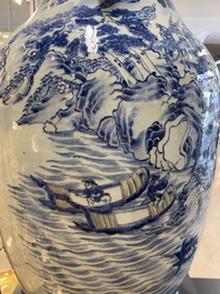 A large Chinese blue, white and copper-red vase with a mountainous river landscape, 19th C.