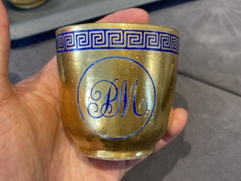 Onze soucoupes et dix tasses en porcelaine de Chine monogramm&eacute;es 'PM' sur fond dor&eacute;, Yongzheng/Qianlong