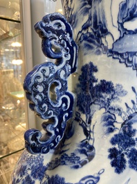 A large Chinese blue, white and copper-red vase with a mountainous river landscape, 19th C.