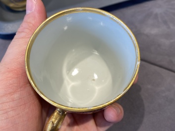 Onze soucoupes et dix tasses en porcelaine de Chine monogramm&eacute;es 'PM' sur fond dor&eacute;, Yongzheng/Qianlong