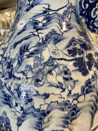 A large Chinese blue, white and copper-red vase with a mountainous river landscape, 19th C.