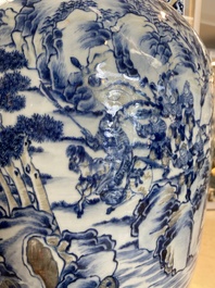 A large Chinese blue, white and copper-red vase with a mountainous river landscape, 19th C.