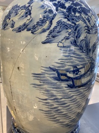 A large Chinese blue, white and copper-red vase with a mountainous river landscape, 19th C.
