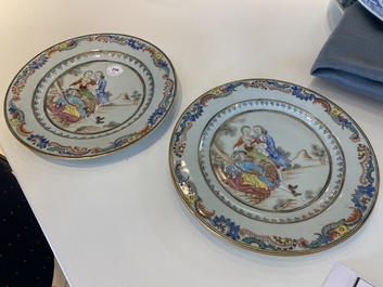 A pair of fine Chinese famille rose plates with a musician playing in front of a couple, Qianlong