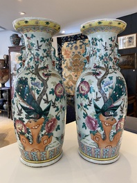 A pair of Chinese famille rose vases with peacocks and phoenixes, 19th C.