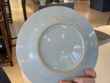 A pair of fine Chinese famille rose plates with a musician playing in front of a couple, Qianlong