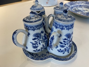 A rare Chinese blue and white set of two jugs and two casters on stand, Qianlong