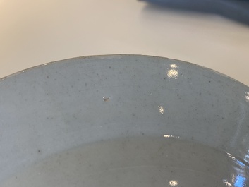 A pair of fine Chinese famille rose plates with a musician playing in front of a couple, Qianlong