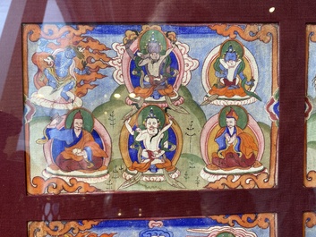 Eight tsaklis and three painted wood book covers, Tibet, 19th C.