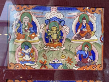 Eight tsaklis and three painted wood book covers, Tibet, 19th C.