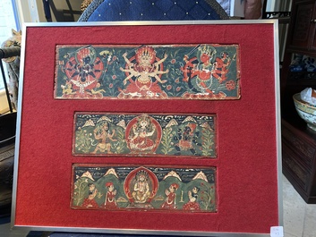 Eight tsaklis and three painted wood book covers, Tibet, 19th C.