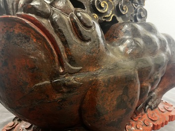 A large Chinese lacquered wooden stand in the shape of a three-legged toad, Ming