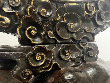 A large Chinese lacquered wooden stand in the shape of a three-legged toad, Ming