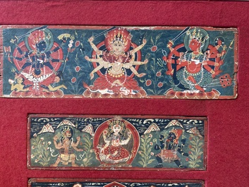 Eight tsaklis and three painted wood book covers, Tibet, 19th C.