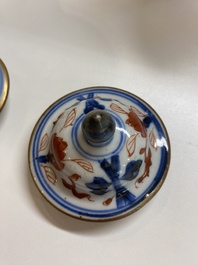 A Chinese grisaille garniture of five 'phoenix' vases, Kangxi/Yongzheng