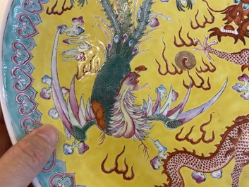 A Chinese yellow-ground famille rose 'dragon and phoenix' dish, Qianlong mark, 19/20th C.