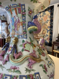 A pair of Chinese Canton famille rose vases with duck-shaped handles, 19th C.