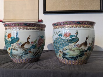 A Chinese famille rose 'hu' vase and a pair of fish bowls, 20th C.