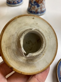 A Chinese grisaille garniture of five 'phoenix' vases, Kangxi/Yongzheng