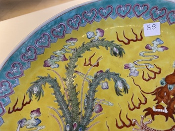 A Chinese yellow-ground famille rose 'dragon and phoenix' dish, Qianlong mark, 19/20th C.