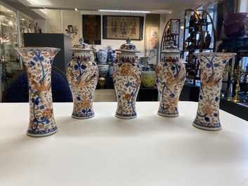 A Chinese grisaille garniture of five 'phoenix' vases, Kangxi/Yongzheng