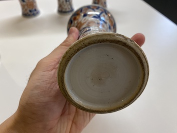 A Chinese grisaille garniture of five 'phoenix' vases, Kangxi/Yongzheng