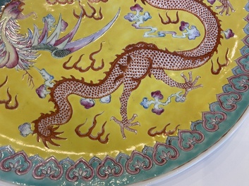 A Chinese yellow-ground famille rose 'dragon and phoenix' dish, Qianlong mark, 19/20th C.