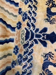 A large Chinese Ningxia rug with dragons on a yellow ground, Tai He Tian 太和殿 mark, 19th C.