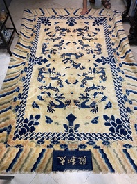 A large Chinese Ningxia rug with dragons on a yellow ground, Tai He Tian 太和殿 mark, 19th C.