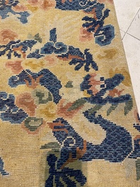 A large Chinese Ningxia rug with dragons on a yellow ground, Tai He Tian 太和殿 mark, 19th C.