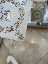 Four polychrome Dutch Delft tiles with animals in aigrette medallions, Haarlem, 17th C.
