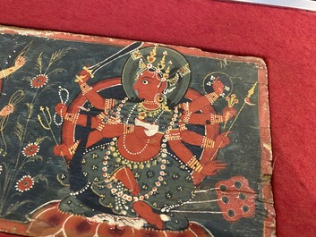 Eight tsaklis and three painted wood book covers, Tibet, 19th C.