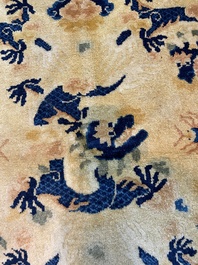 A large Chinese Ningxia rug with dragons on a yellow ground, Tai He Tian 太和殿 mark, 19th C.