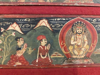 Eight tsaklis and three painted wood book covers, Tibet, 19th C.