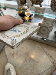 Four polychrome Dutch Delft tiles with animals in aigrette medallions, Haarlem, 17th C.