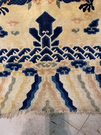 A large Chinese Ningxia rug with dragons on a yellow ground, Tai He Tian 太和殿 mark, 19th C.