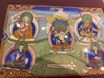 Eight tsaklis and three painted wood book covers, Tibet, 19th C.