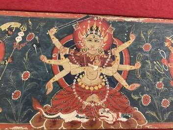Eight tsaklis and three painted wood book covers, Tibet, 19th C.