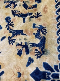 A large Chinese Ningxia rug with dragons on a yellow ground, Tai He Tian 太和殿 mark, 19th C.