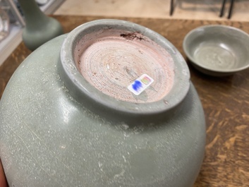 A Chinese celadon-glazed bottle vase and two bowls, Yuan/Ming