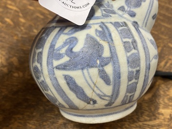 A Chinese blue and white kendi and a small vase, Hatcher Cargo, Transitional period