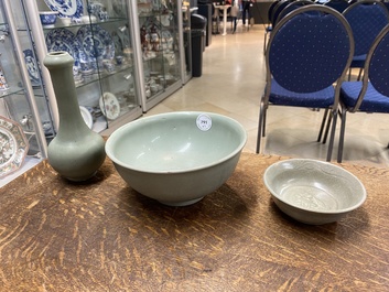 A Chinese celadon-glazed bottle vase and two bowls, Yuan/Ming