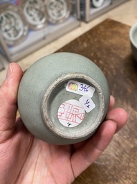 A Chinese celadon-glazed bottle vase and two bowls, Yuan/Ming