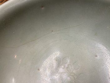 A Chinese celadon-glazed bottle vase and two bowls, Yuan/Ming